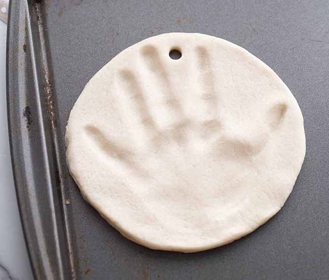 Place Handprint on Baking Tray